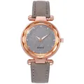 Detail of rose gold faceted bezel and grey glitter dial on a minimalist quartz watch - Gray