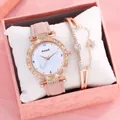 Primer plano de reloj de cuarzo para mujer y pulsera de estrella en caja de regalo rosa - Rosa + Pulsera + Caja