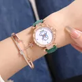 Close-up of green quartz watch and rose gold star bracelet set on woman wrist - Green Watch + Bracelets