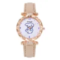 Detail of rose gold quartz watch with rhinestone bezel and cartoon dog dial on beige leather - Beige