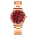 Macro shot of rose gold fashion watch featuring creative textured dial and metal strap - Red