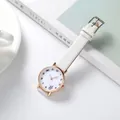Close-up of white quartz watch with cute bow illustration and leather texture strap - White