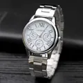 Close-up of Geneva silver steel watch with Roman numerals and white dial display - Silver Case White Dial
