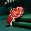Elegant red leather quartz watch with gold geometric dial on dark green background - Red