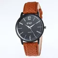 Detailed macro of vintage quartz watch with brown textured leather strap and black dial - Brown Strap Black Dial