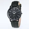 Classic business quartz watch with black dial and dark green woven strap on white background - Green Strap Black Face