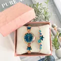 Roségouden dameshorloge en sterarmband met blauwe edelstenen in roze geschenkdoos - Horloge+Armband+Doos