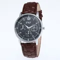 Detail of quartz watch with black honeycomb dial and textured brown leather strap - Coffee Strap Black Face