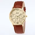 Macro detail of gold watch case with sunray dial and brown textured leather strap - Brown Strap Gold Dial