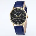 Close-up of business watch with blue leather strap, gold case, and black wave dial - Blue Strap Black Dial