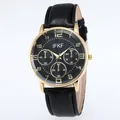 Detailed close-up of IFKF luxury gold watch face with black textured dial and leather strap - Black Strap Black Dial