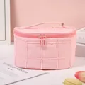 Quilted pink makeup bag with top handle and double zipper for travel and storage - Peach Pink