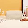 Minimalist beige woven PU leather makeup bag with gold zipper for travel storage - Woven Pattern / White