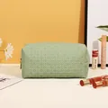 Minimalist light green PU leather toiletry bag with elegant woven texture and gold zipper - Woven Pattern / Green