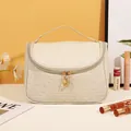 Creamy white large makeup bag with woven texture and top handle for travel storage - Woven Texture / Off White