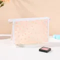 Transparente Make-up Tasche mit orangen Gänseblümchen Mustern und praktischem Tragegriff - Rosa