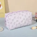 Light purple floral makeup bag with embossed flower texture and star zipper charm - Purple
