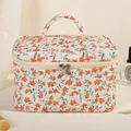 Gesteppte Baumwoll-Kosmetiktasche mit orangem Blumenmuster und Doppelreißverschluss - Orange/Floral