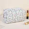 Quilted floral makeup bag in white and purple flower pattern with secure zipper closure - Purple Floral