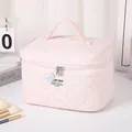 Pink quilted cosmetic bag with cute bear patch and sturdy top handle design - Pink
