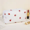 Quilted floral cosmetic bag with red tomato pattern and silver zipper closure - White/Persimmon