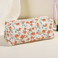 Quilted floral makeup bag in cream white with red flower pattern and silver zipper - Orange Floral