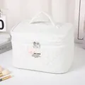 White quilted bubble bear makeup bag with top handle and elegant double zipper closure - White