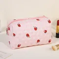 Pink quilted floral makeup bag with strawberry patterns and a top zipper closure - Pink/Persimmon