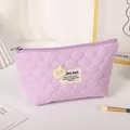 Purple quilted makeup bag with teddy bear patch and secure zip closure for travel - Purple