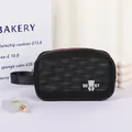 Portable black mesh toiletry bag with white bear pattern and zipper closure - Black