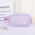 Purple mesh travel toiletry bag with handle and cartoon bear patch for easy organization - Purple