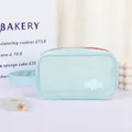 Light blue mesh toiletry bag with red zipper, side handle and cute bear patch - Aqua