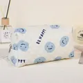 Quilted makeup bag with blue smile patterns and 'BE HAPPY' text in creamy white - Blue Smile Face / 19.5*8.5*11CM / Blue/Smiley