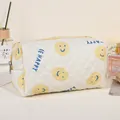 Quilted beige cosmetic bag featuring a yellow smiley face and BE HAPPY text - Yellow/Smiley