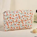 Quilted makeup bag with orange floral print and premium metal zipper closure - Orange Floral