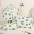 Lot de 3 trousses de maquillage matelassées beige avec motif smiley vert et texte be happy - Visage Vert/souriant