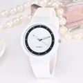Minimalist white quartz watch with silicone strap and elegant accessories display - White