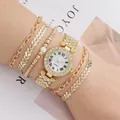 Elegant gold quartz watch set for women with rhinestone bezel and four matching bracelets - Gold Watch And Bracelets