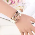 Detail of rose gold rectangular quartz watch with colorful numbers and white rivet leather strap - White