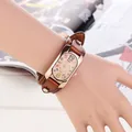 Close-up of retro wide leather band watch with colorful numerals and rose gold frame - Light Coffee
