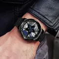Men's black metal watch with automotive wheel hub dial and blue brake caliper accents - Steel Band Wheel Hub Blue Caliper / Blue Steel Band