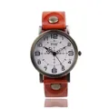 Vintage quartz watch with brown leather strap and retro bronze metal case on white background - Orange