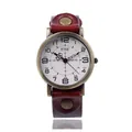Macro shot of industrial retro quartz watch with wide burgundy leather strap and bronze case - Red
