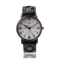 Macro shot of vintage CCQ leather watch strap with bronze rivets and retro metal case - Green