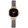 Macro view of women's quartz watch with starry sky dial and shimmering crystal strap - Rose Gold Black