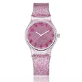 Macro detail of the sparkling pink glitter dial and transparent resin watch strap - Rose Red