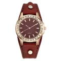 Macro detail of wine red wave texture dial and sparkling crystal bezel quartz watch - Red