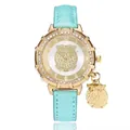 Elegant gold owl pendant watch with diamond-set bezel and light blue glitter leather strap - Sky Blue
