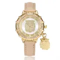 Detail of owl pendant and gold dial with sparkling champagne leather strap on watch - Khaki