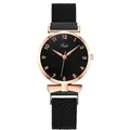Detail of a minimalist quartz watch with black sunray dial and rose gold mesh strap - Black Watch Only
